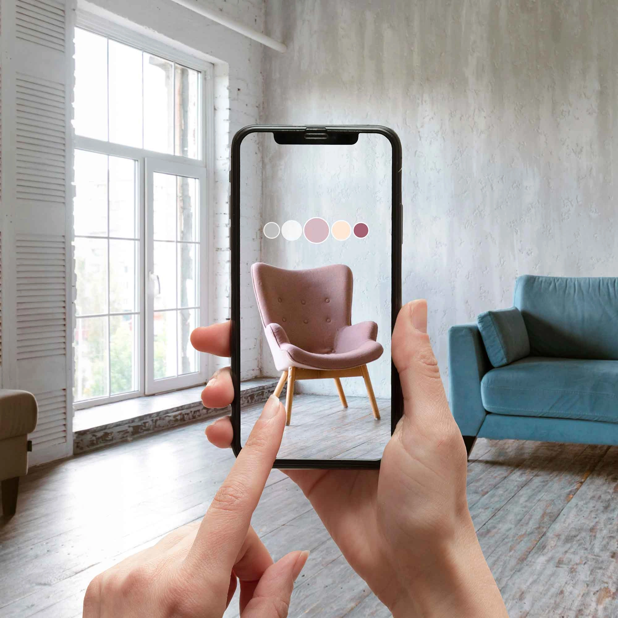 A person displays a smartphone showcasing a virtual room, highlighting AR/VR 3D Modeling Services